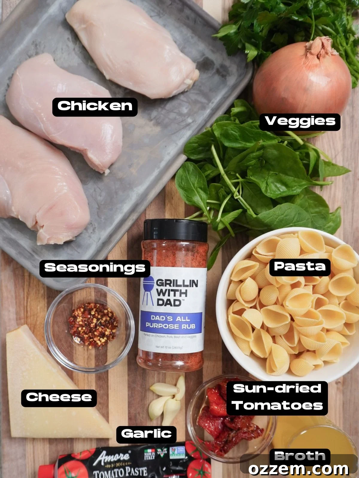 Assortment of fresh ingredients for Easy Marry Me Chicken Soup, including chicken breasts, spinach, sun-dried tomatoes, and spices.