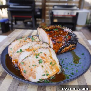 Grilled Apple Cider Pork Roast sliced and plated.