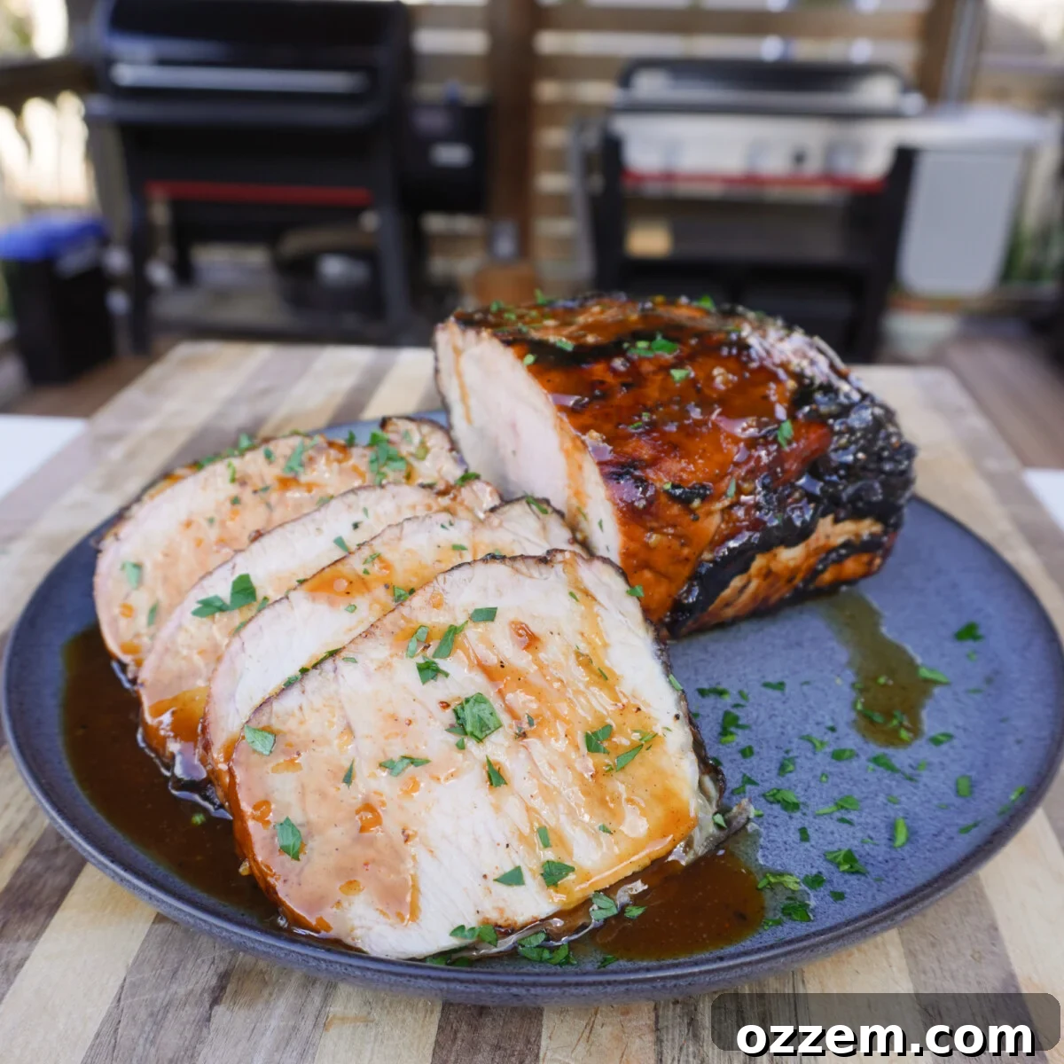 Grilled Apple Cider Pork Roast sliced and plated.