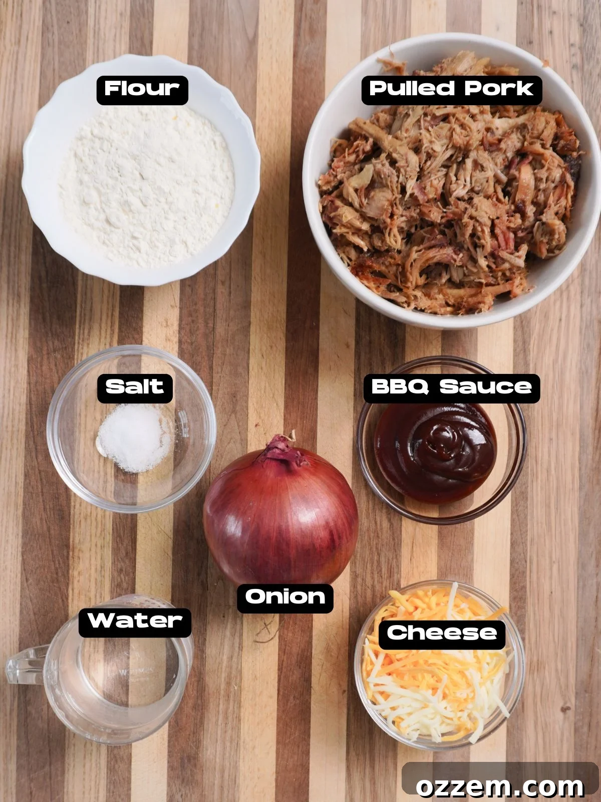 BBQ Pulled Pork Pierogi 4 A collection of ingredients laid out, including pulled pork, BBQ sauce, cheese, onions, flour, water, and salt.