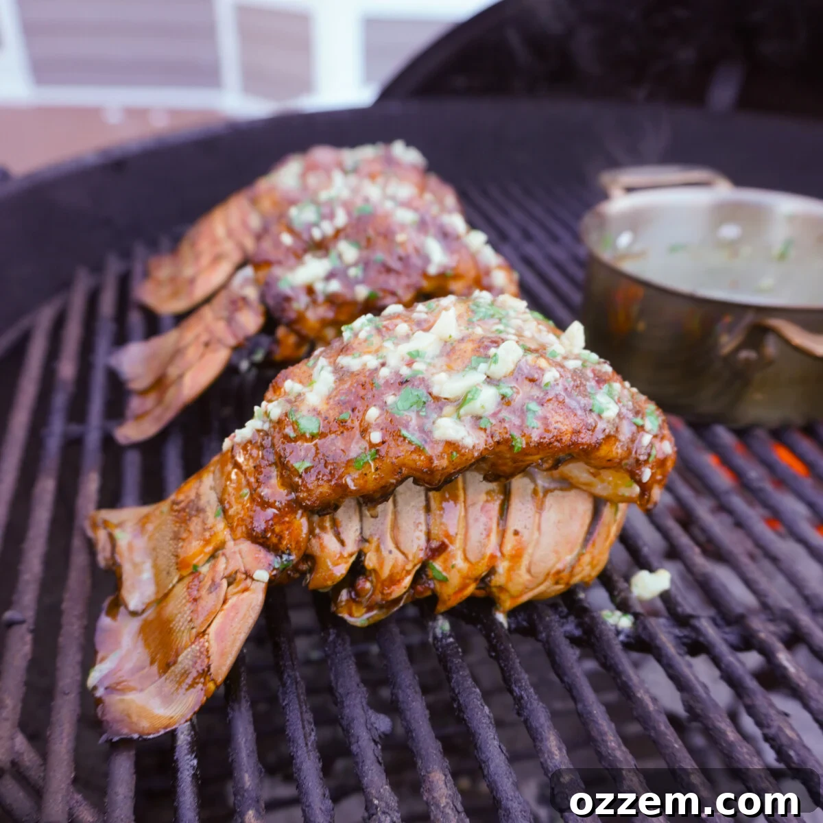 Smoked Cajun Lobster Tail on the grill, a luxurious seafood dish.