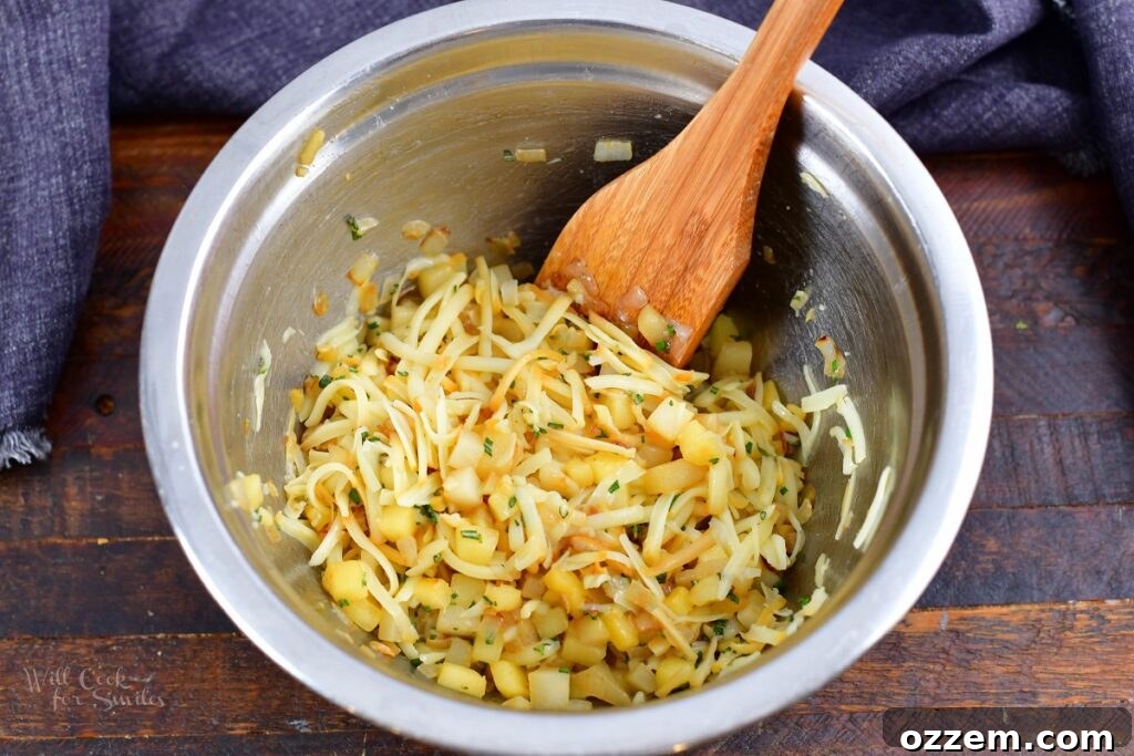 stuffing in a mixing bowl with a wooden spatula