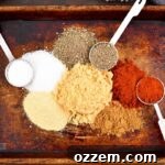 spices for the beef rub on the tray and spoons