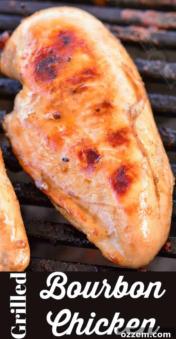 Bourbon Glazed Grilled Chicken 2 Perfectly grilled bourbon chicken breasts sizzling on a barbecue, showcasing a beautiful char and juicy interior.