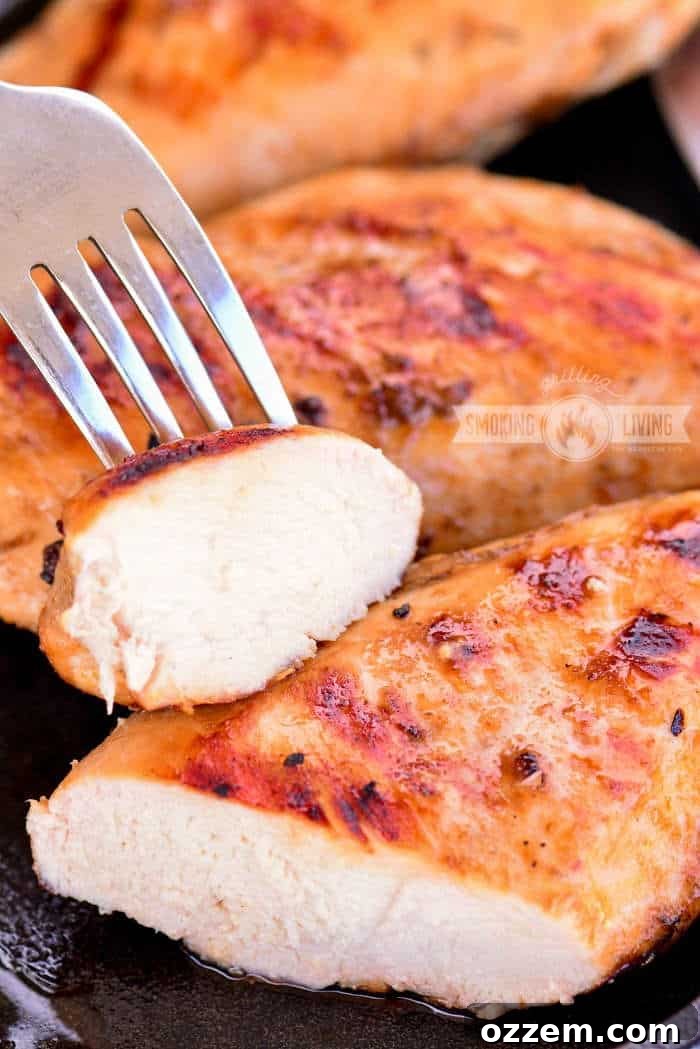 Bourbon Glazed Grilled Chicken 7 Close-up of perfectly cut and cooked grilled bourbon chicken, showing the tender meat and caramelized edges.