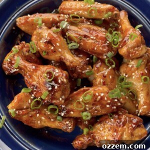 Honey Garlic Chicken Wings served with fresh garnishes