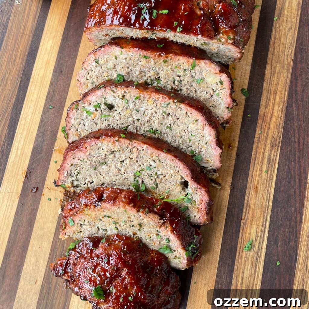 Perfectly grilled meatloaf with a rich, spicy glaze, ready to be sliced