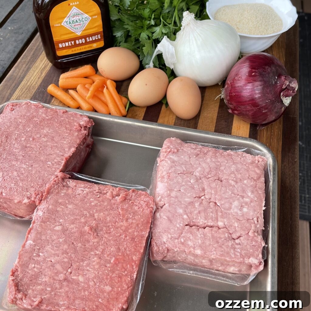 Raw meatloaf mixture being mixed by hand in a large bowl
