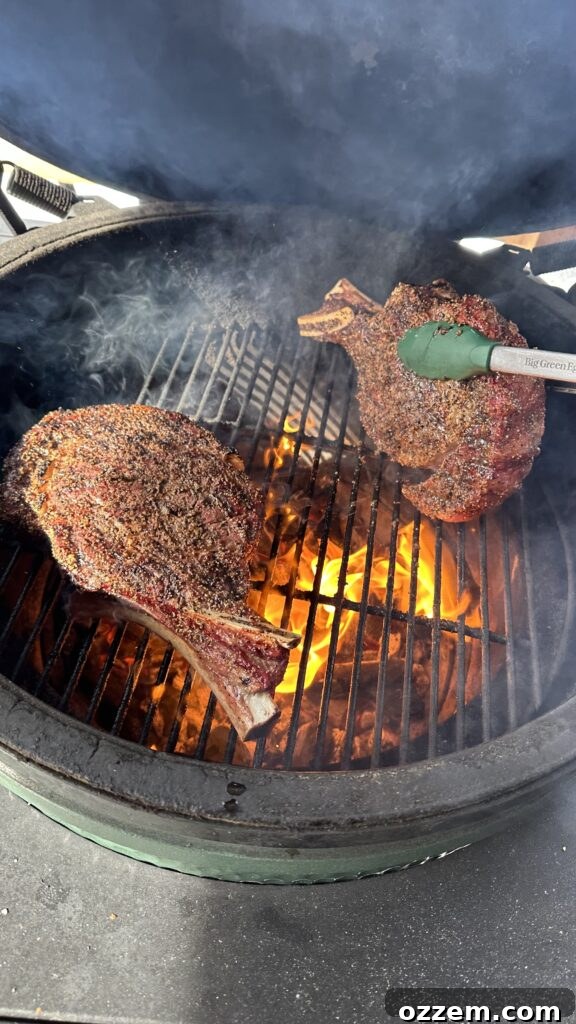 Flame-Kissed Bone-in Ribeye 4 Grilled bone-in ribeye steak resting after being removed from the grill, tented with foil.