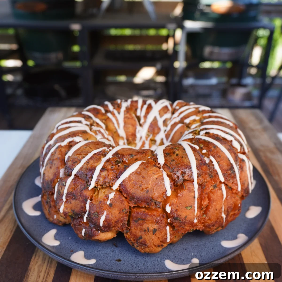 Close-up of golden brown Garlic and Herb Monkey Bread, pulled apart to show fluffy interior.