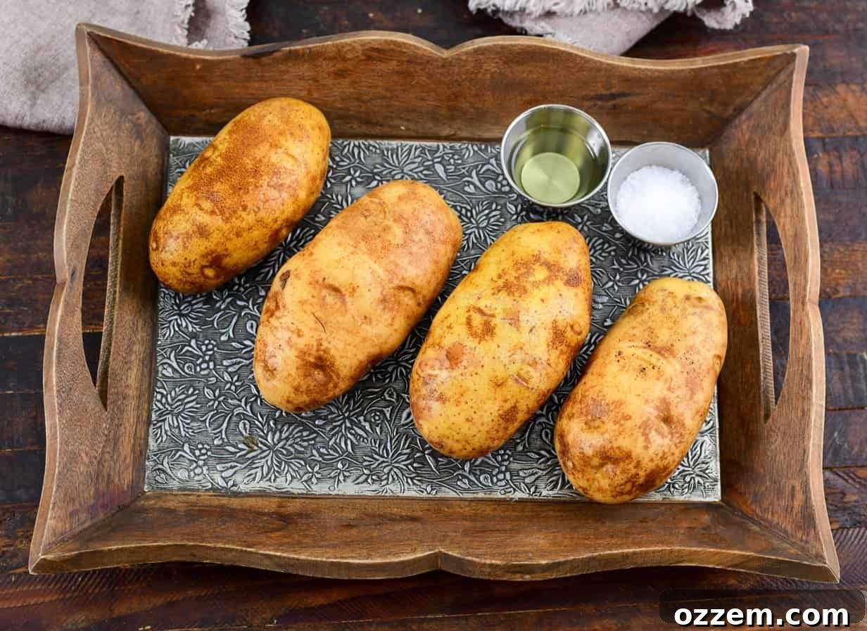 Smoky Creamy Twice Baked Potatoes 5 Raw potatoes with salt and oil in cups