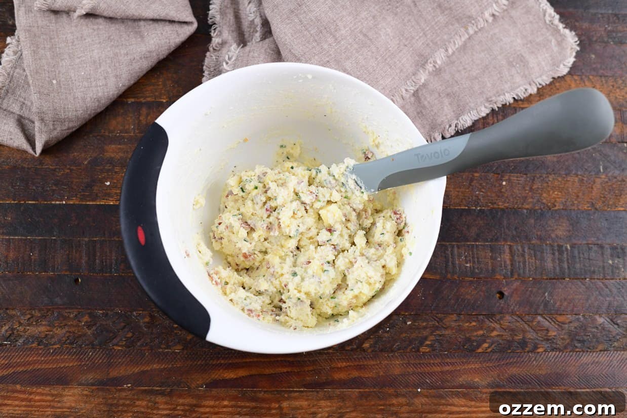 Smoky Creamy Twice Baked Potatoes 10 filling in a white bowl