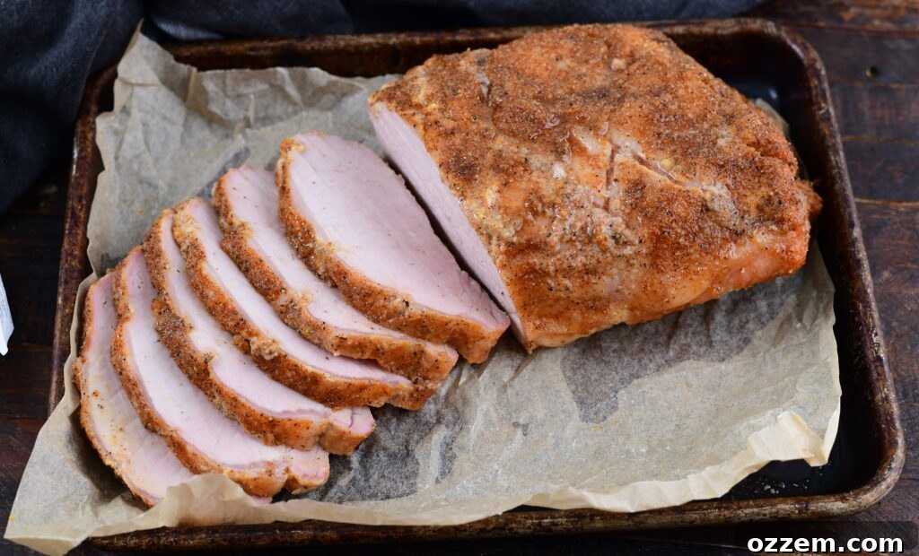 Wood-Fired Pork Loin Perfection 15 Perfectly sliced smoked pork loin ready for plating and serving.