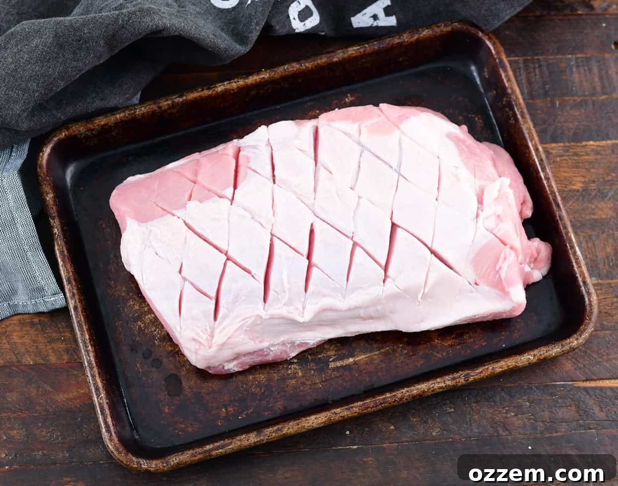 Wood-Fired Pork Loin Perfection 5 Trimming the fat cap of a pork loin to the ideal 1/4 inch thickness.