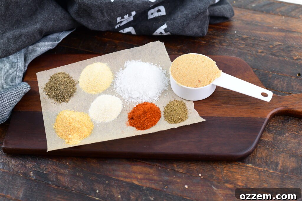 Wood-Fired Pork Loin Perfection 8 A selection of spices for the pork rub, artfully arranged on a wooden paddle.