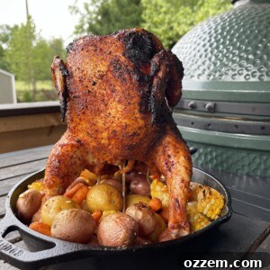 Easy Grilled Whole Chicken with Roasted Vegetables in a cast iron skillet.