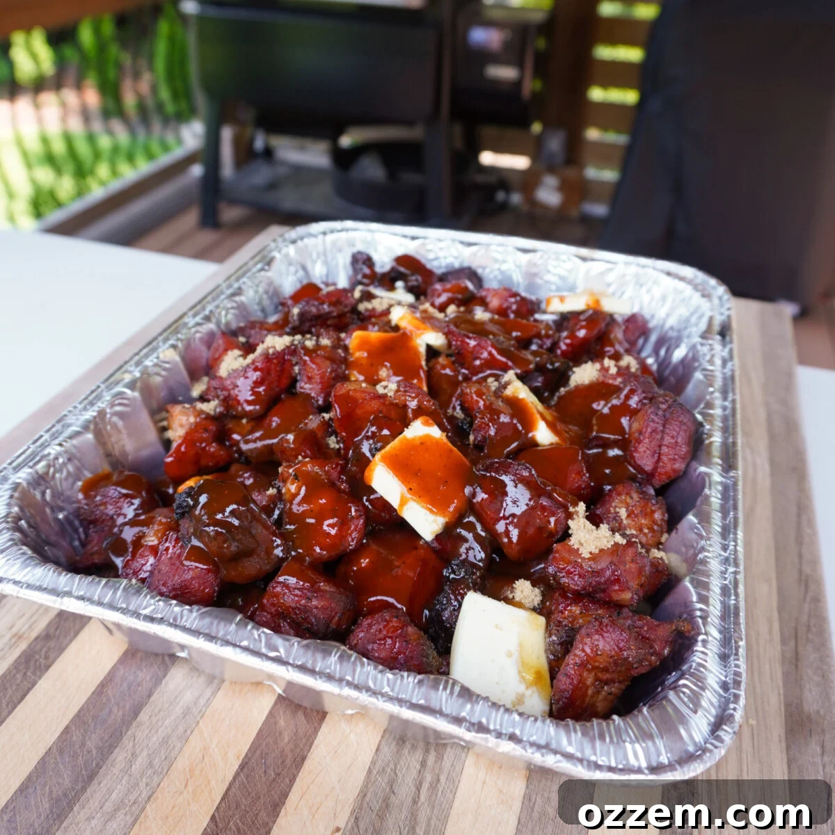 Succulent Pork Poppers 8 Sweet ingredients like butter, brown sugar, and honey added to smoked pork in a pan.