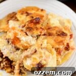 Cooked Smoked Scalloped Potatoes on a white plate