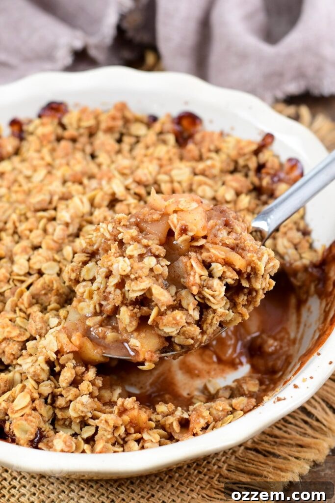 A serving of Smoked Apple Crisp with vanilla ice cream
