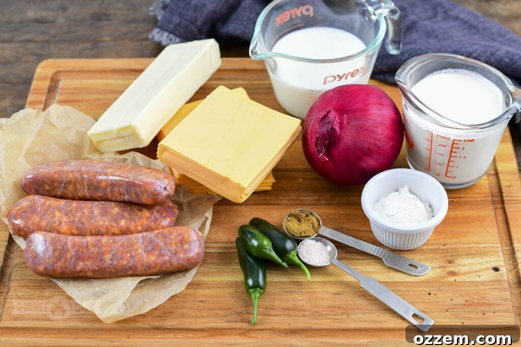 Campfire Queso Dip 3 A vibrant collection of ingredients for smoked queso dip, including shredded cheeses, whole milk, heavy cream, chorizo, jalapenos, and a red onion.