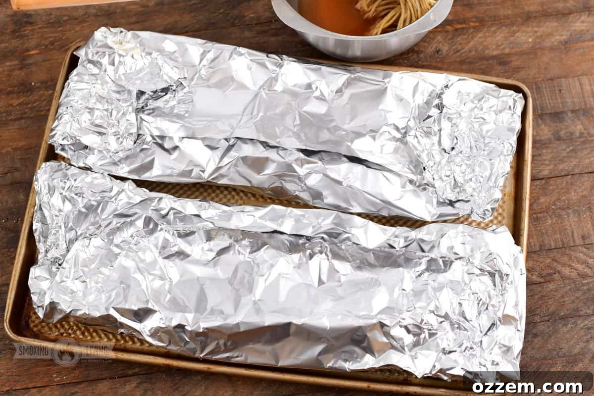 321 ribs wrapped tightly in foil, ready for braising