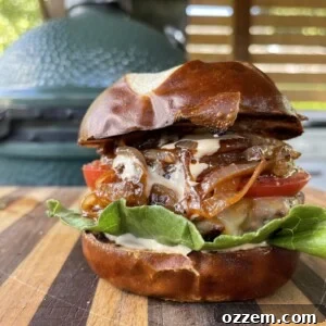 The finished Venison Beef Burger, served on a pretzel bun with all the fixings.