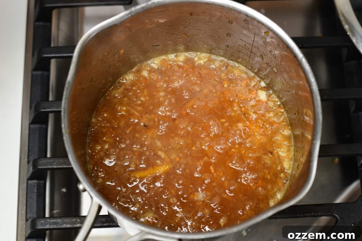 Sauce simmering on a stove.
