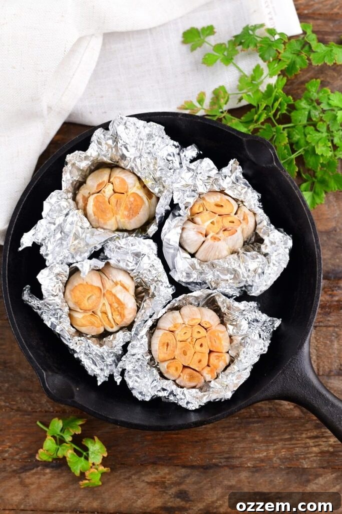 Smoked roasted Garlic in a skillet, golden brown and ready to be enjoyed.