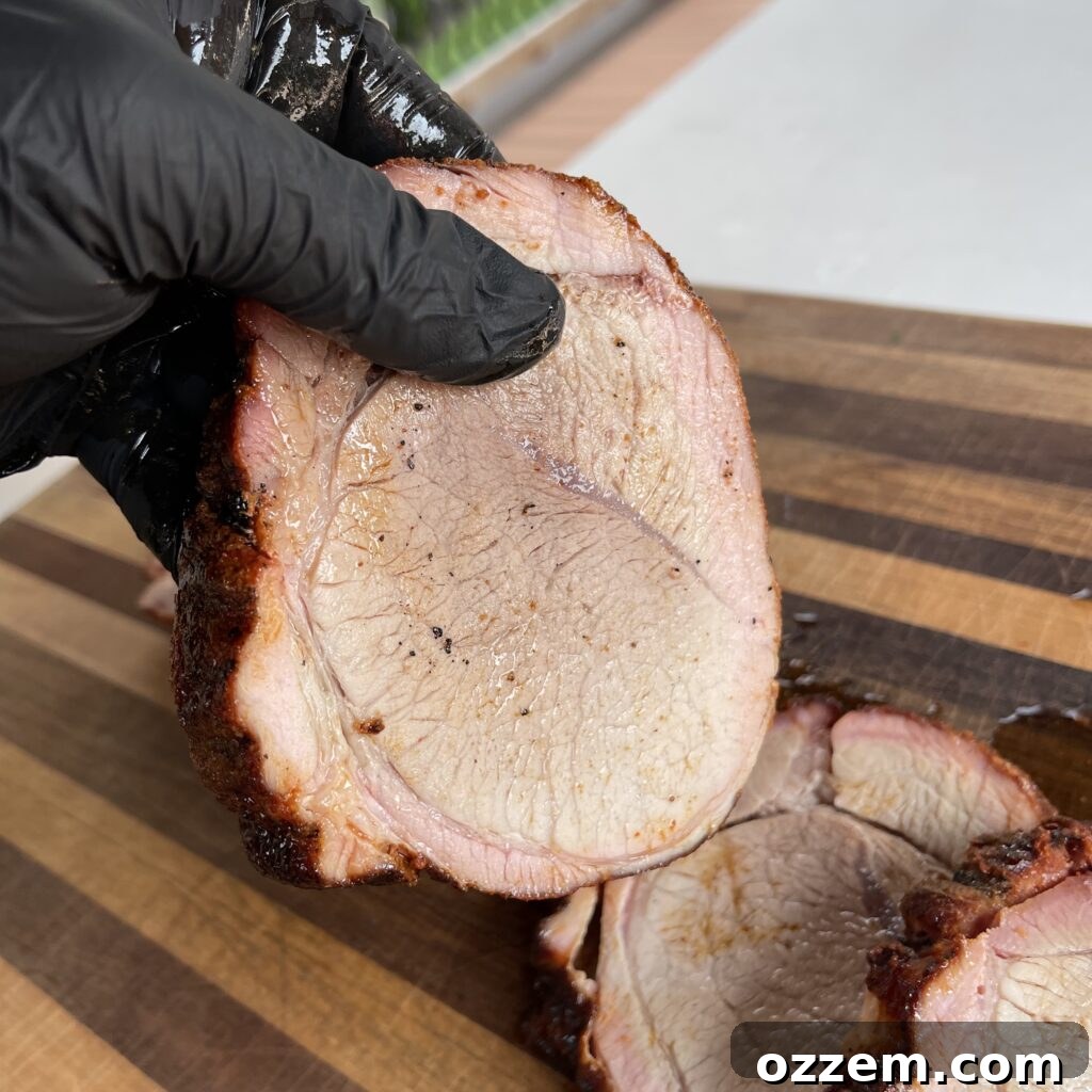Sliced petite shoulder pork roast with mushroom sauce and parsley