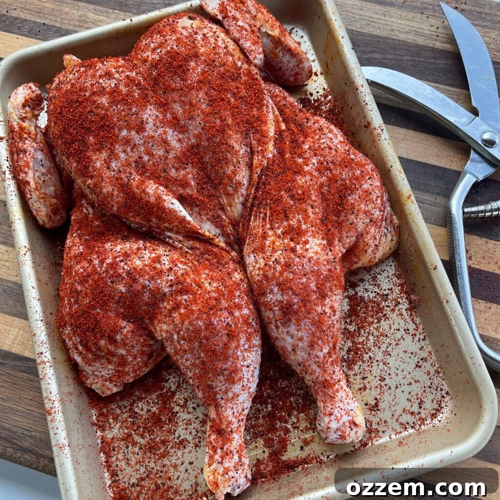 Smoky Chicken Dip 3 Spatchcocked chicken seasoned and ready for the grill, showcasing the butterflied technique.