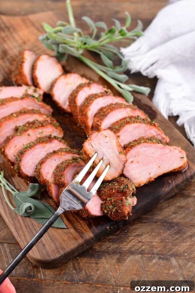Slow-Smoked Pork Perfection 11 cooked smoked tenderloin on a fork