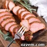 cooked smoked tenderloin on a fork