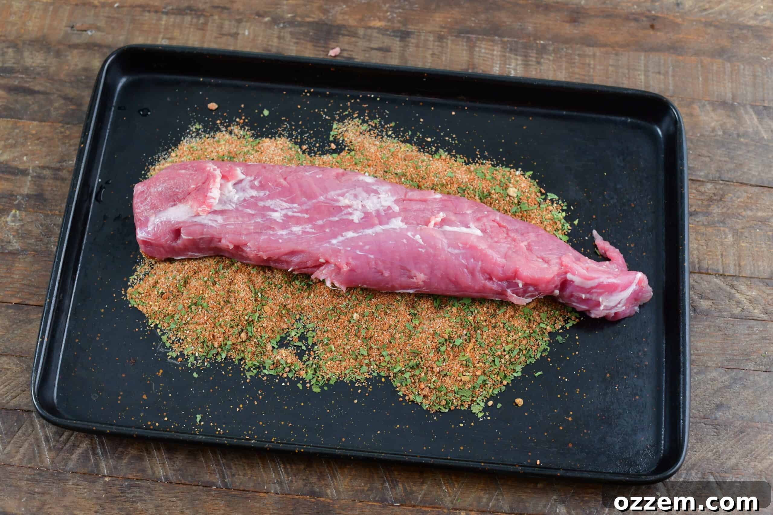 Slow-Smoked Pork Perfection 6 raw pork tenderloin on sheet tray before covering in dry rub