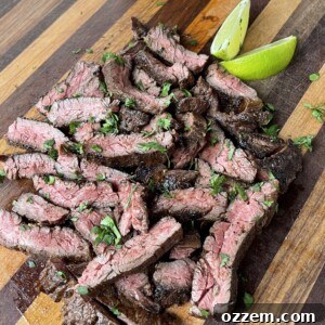 Grilled Tequila Lime Skirt Steak sliced and ready to serve, garnished with fresh cilantro.