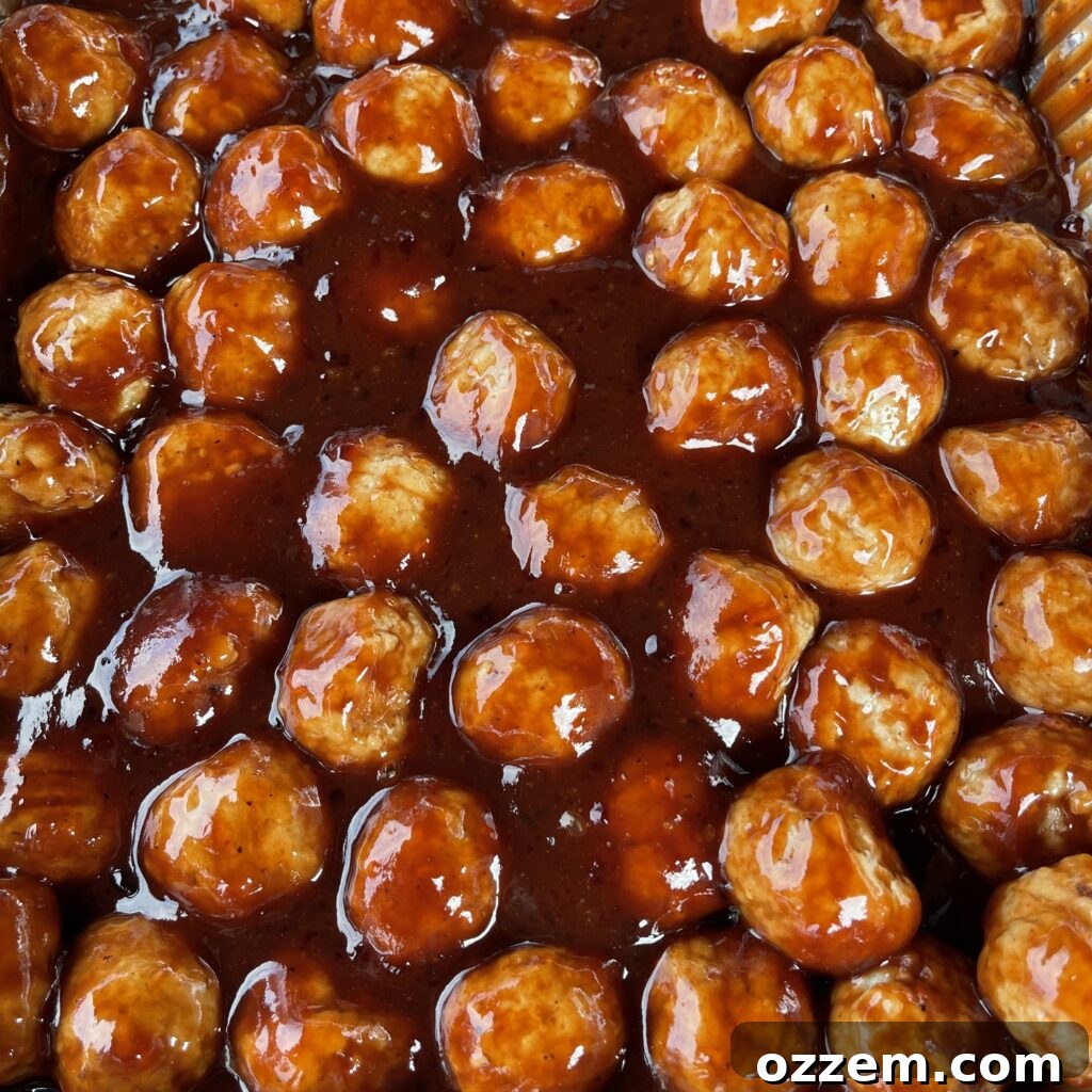 Mixing the unique PB&J BBQ sauce ingredients in an aluminum pan.