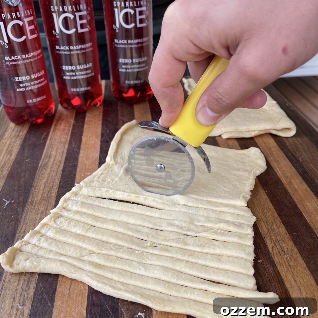 Monster Mummy Bites 3 Crescent roll dough sliced into thin strips for mummy dog bandages