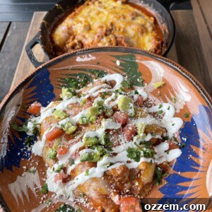 Finished grilled chicken enchiladas in a pan