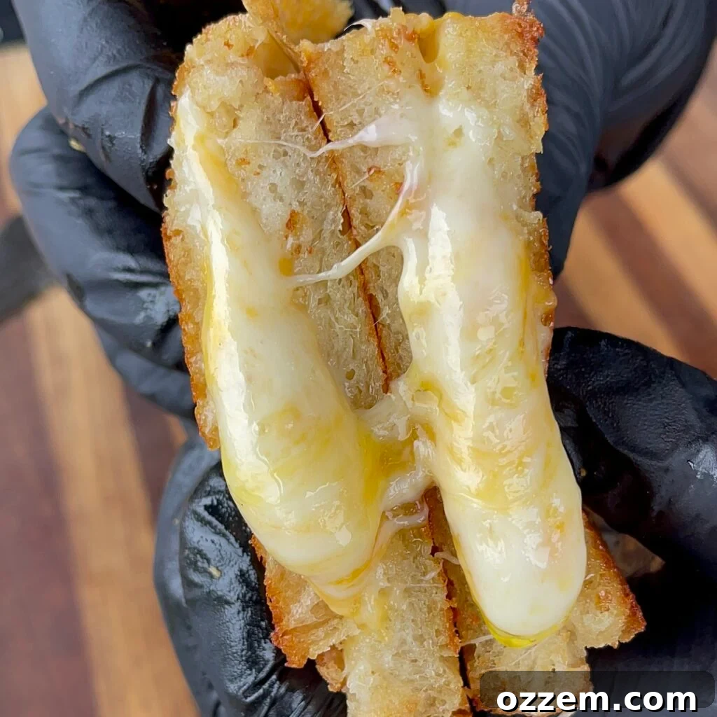 The classic cheese-only grilled cheese cooking to perfection