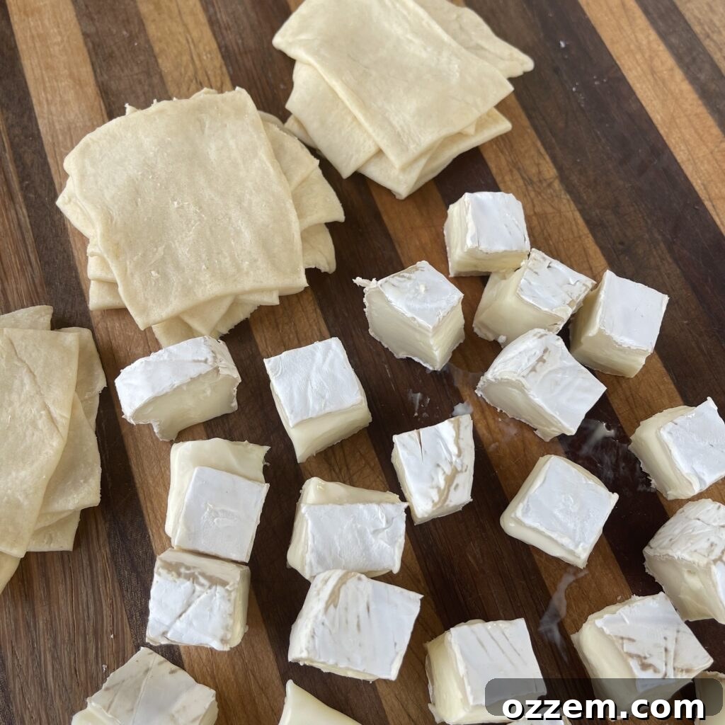 Close-up of crescent dough perforations being pinched together.