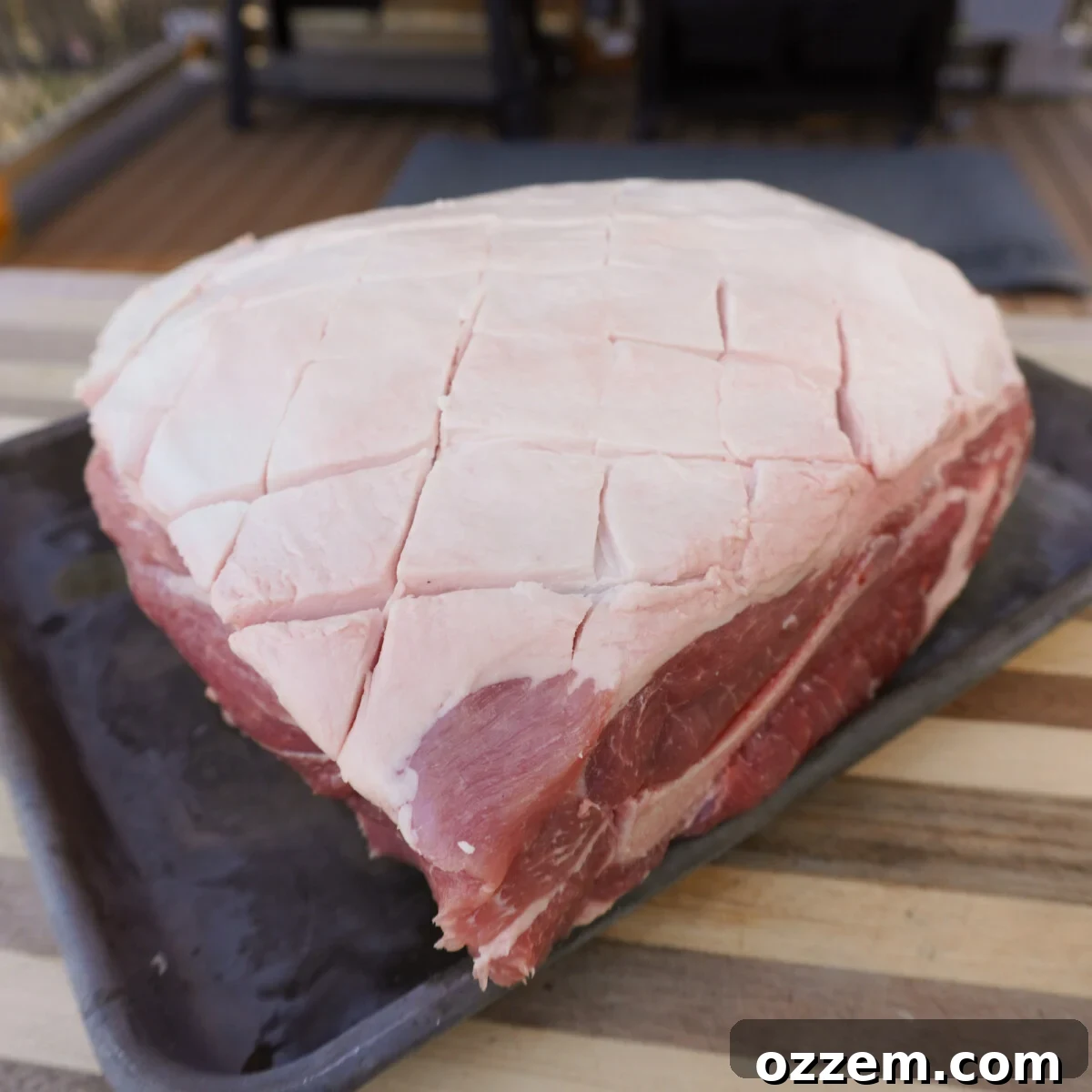 Timeless Pulled Pork Perfection 5 Scoring the fat cap on a pork shoulder for better flavor penetration.