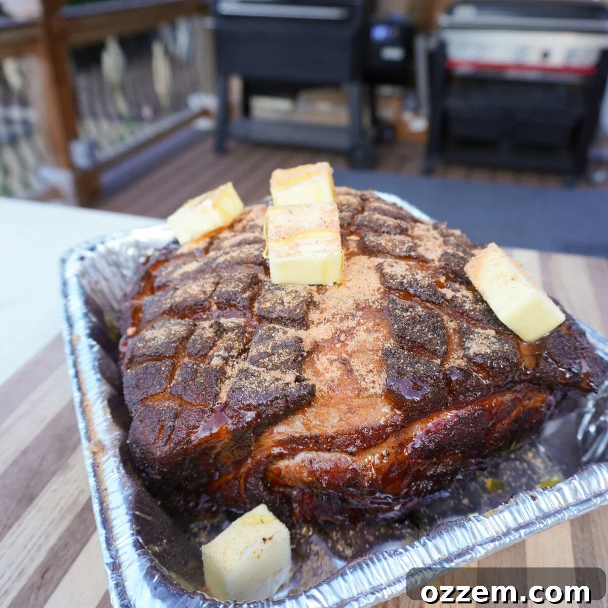 Timeless Pulled Pork Perfection 10 Smoked classic pulled pork being prepared for wrapping with butter, brown sugar, and honey.