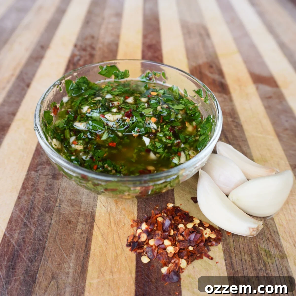 A bowl of vibrant homemade chimichurri sauce, showcasing its fresh herbs and rich color.