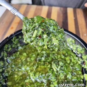 A vibrant bowl of homemade chimichurri sauce.