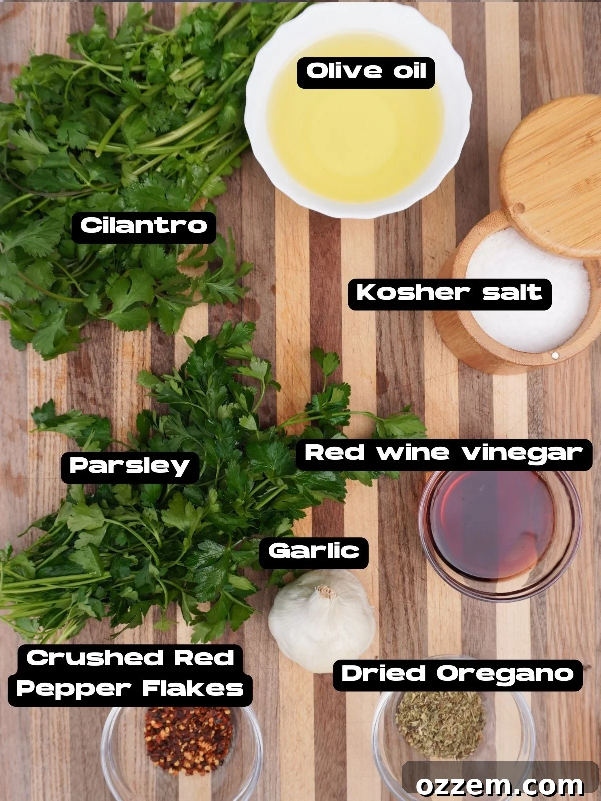 Fresh ingredients for homemade chimichurri sauce laid out on a cutting board.