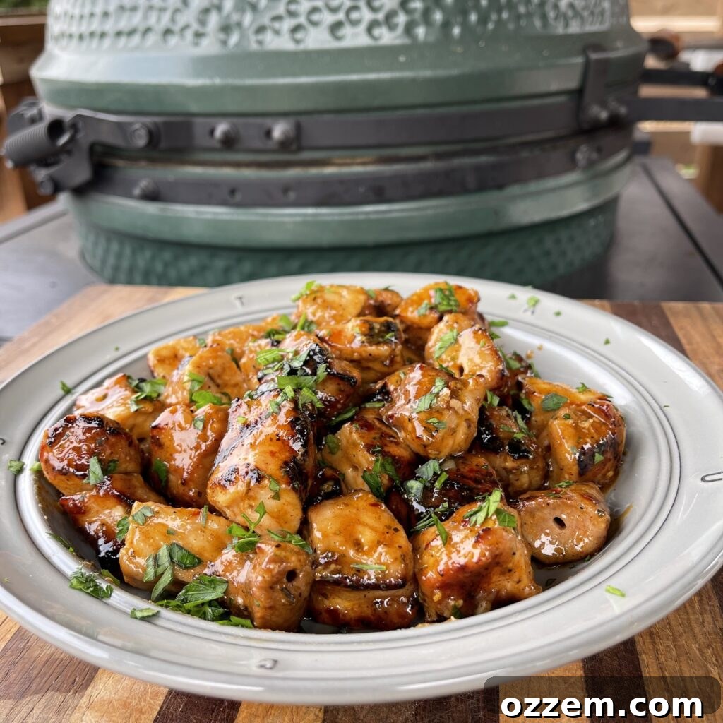 Cajun Honey Pork Bites served in a bowl, garnished with parsley
