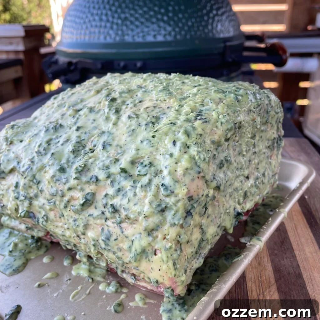 Garlic and herb covered prime rib, chilled and ready for cooking.