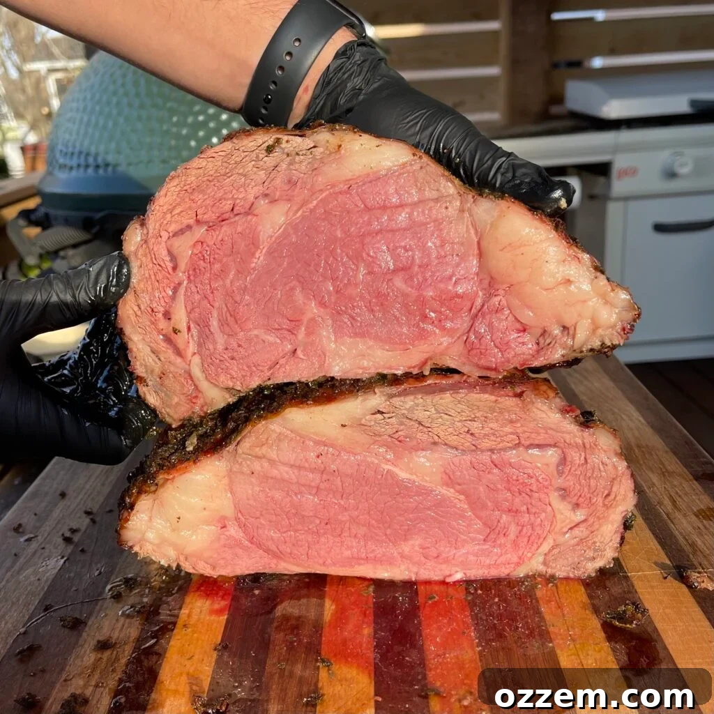 A perfectly cooked medium-rare grilled prime rib, sliced and ready to serve.