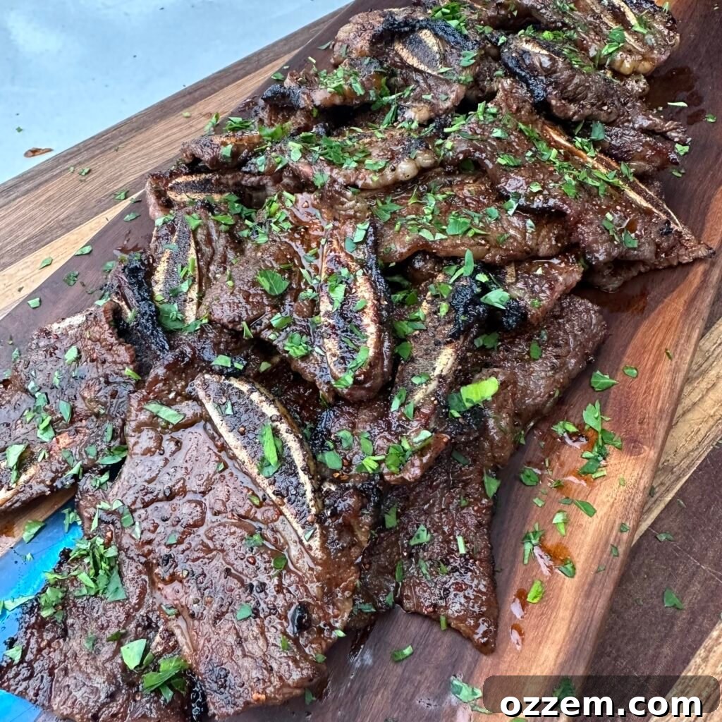 Flame-Kissed Beef Ribs 2 Perfectly grilled flanken style beef ribs, ready to serve.