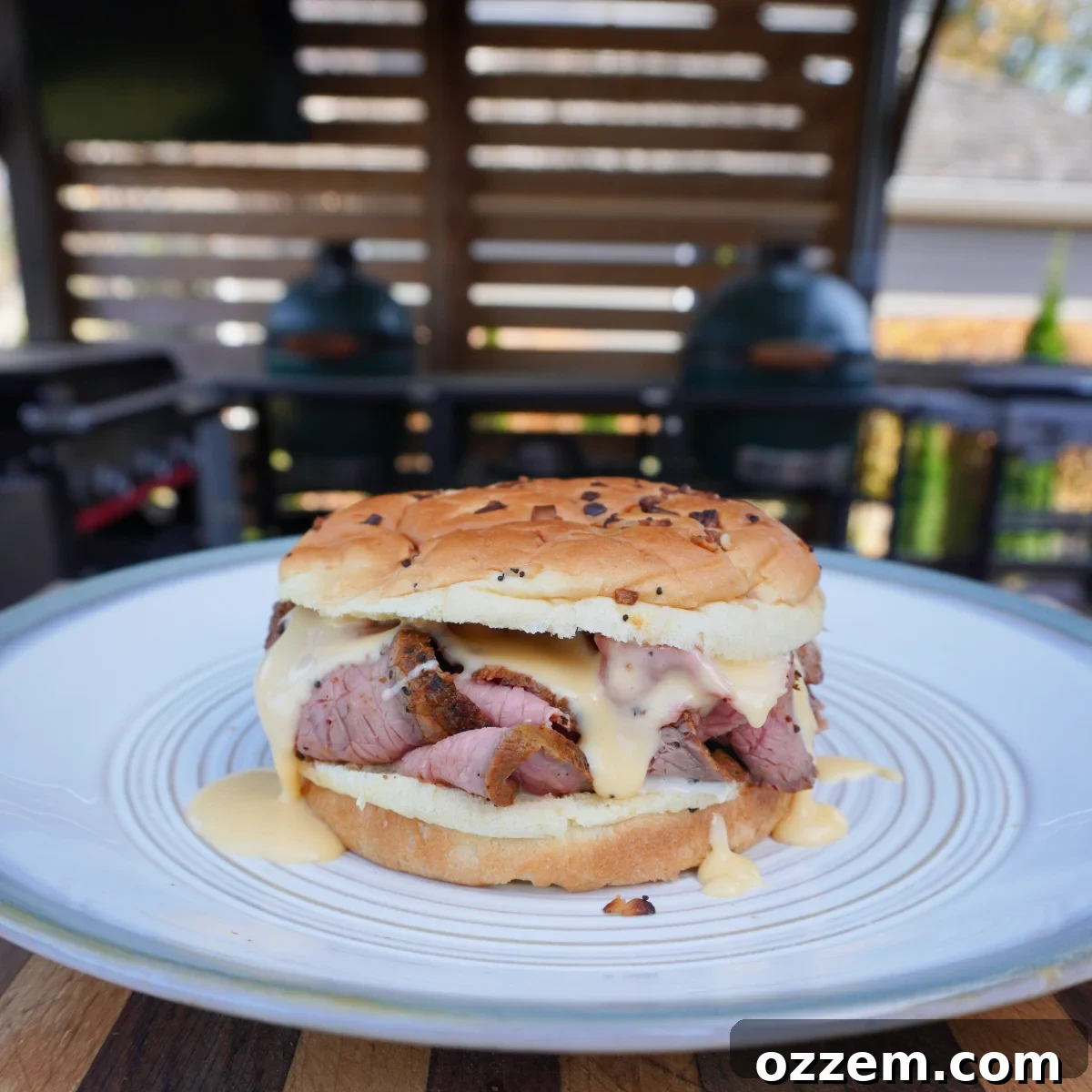 The finished Smoked Beef and Cheddar sandwich, perfectly presented on a plate.