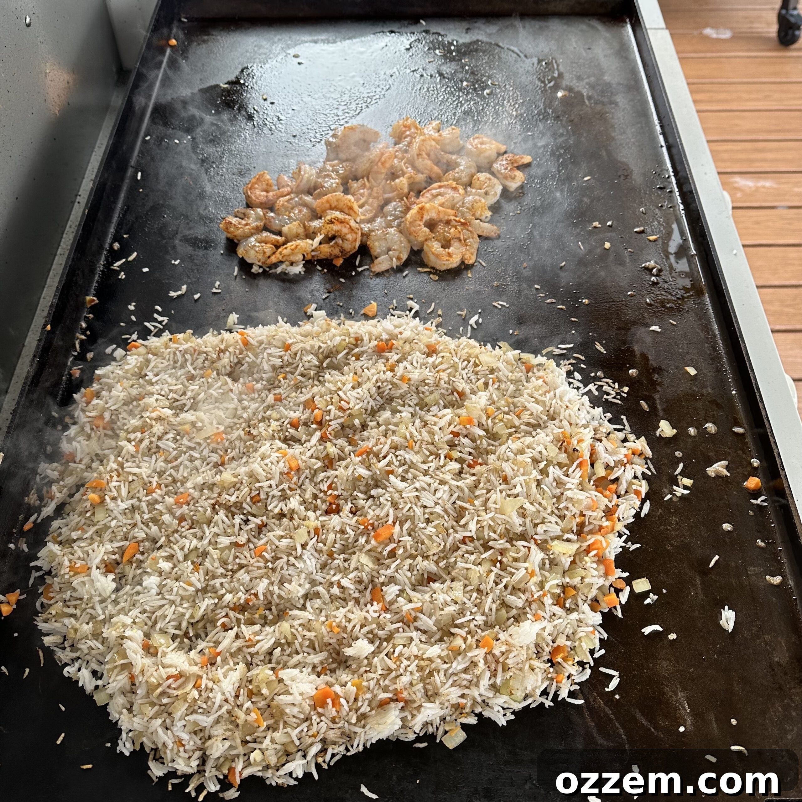 Flavorful Shrimp Fried Rice 5 Shrimp, rice, and vegetables cooking on a hot griddle, hibachi style.